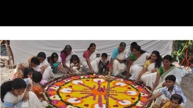 Women Decorating Rangoli On The Eve of Onam