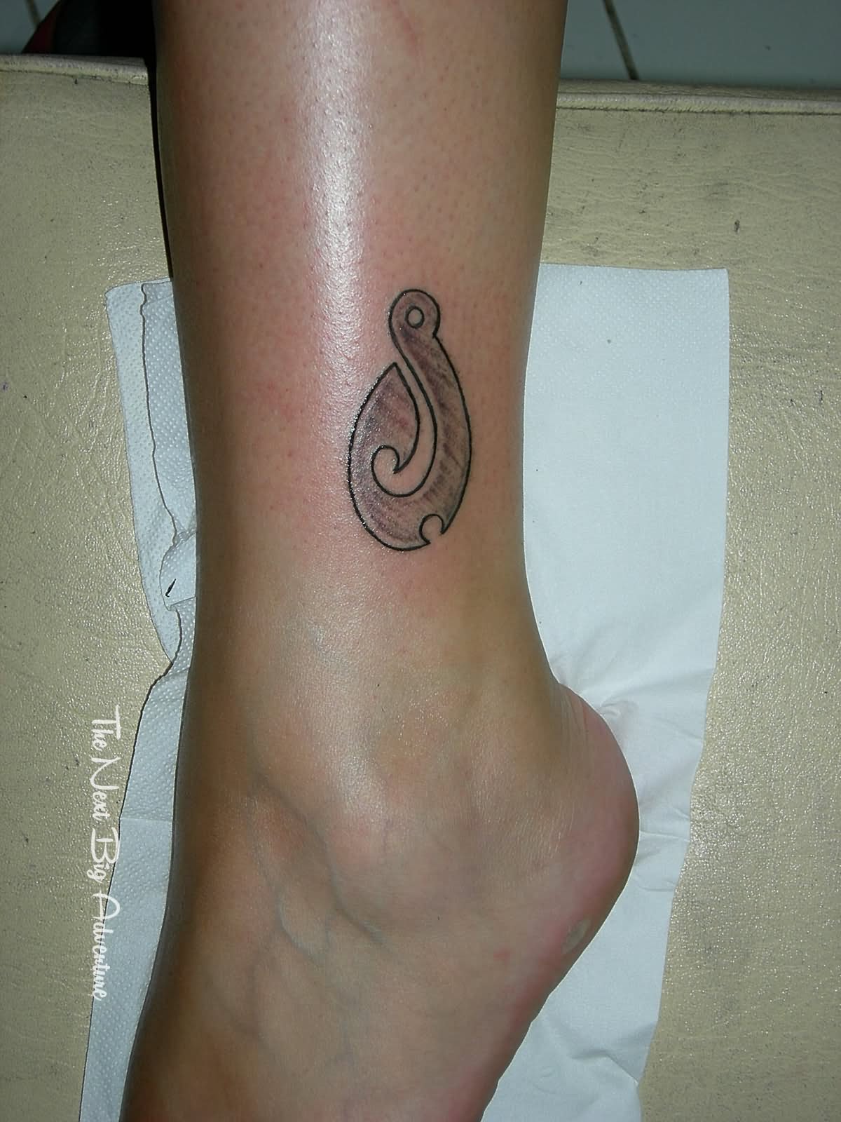 Wonderful Tribal Hook Tattoo Design For Leg