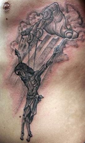 Black And Grey Marionette Jesus Tattoo Design For Side Rib