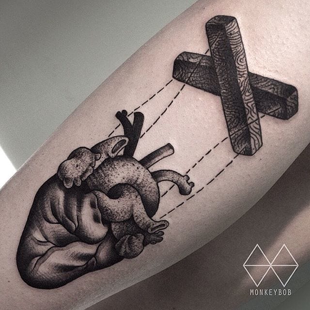 Black Ink Marionette Real Heart Tattoo Design For Arm By Monkey Bob