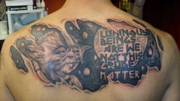 Black Ink Ripped Skin Star Wars Yoda Tattoo On Upper Back