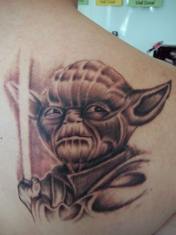 Black Ink Star Wars Yoda Tattoo On Right Back Shoulder