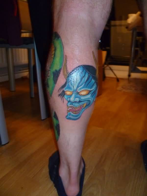 Blue Ink Hannya Mask Tattoo On Leg Calf