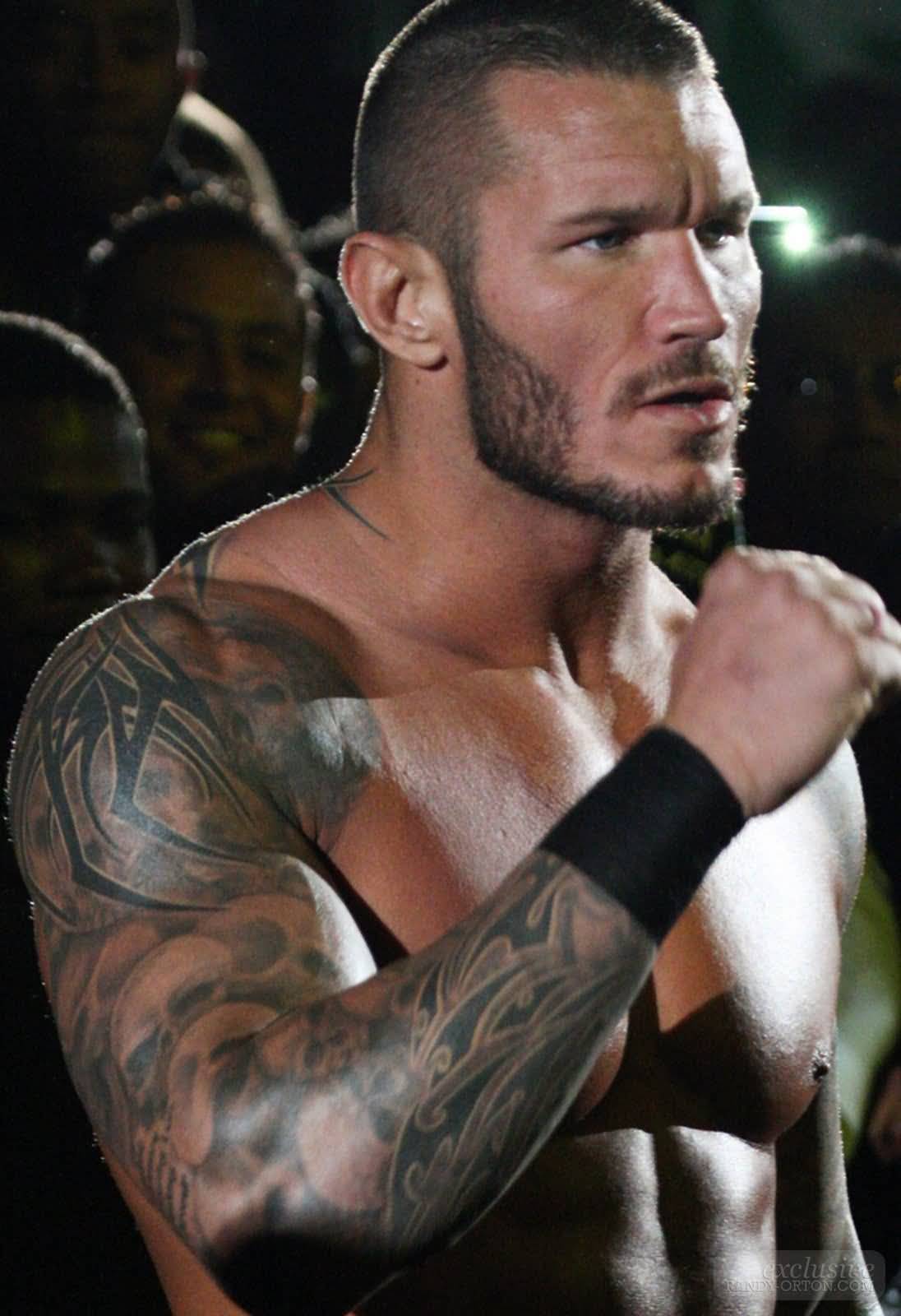 Cool Tribal Design Tattoo On WWE Randy Orton Right Full Sleeve
