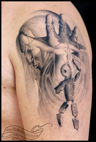 Grey Ink Marionette Doll Tattoo On Left Shoulder