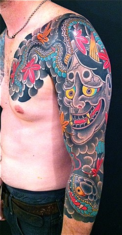 Japanese Hannya Tattoo On Chest And Left Sleeve