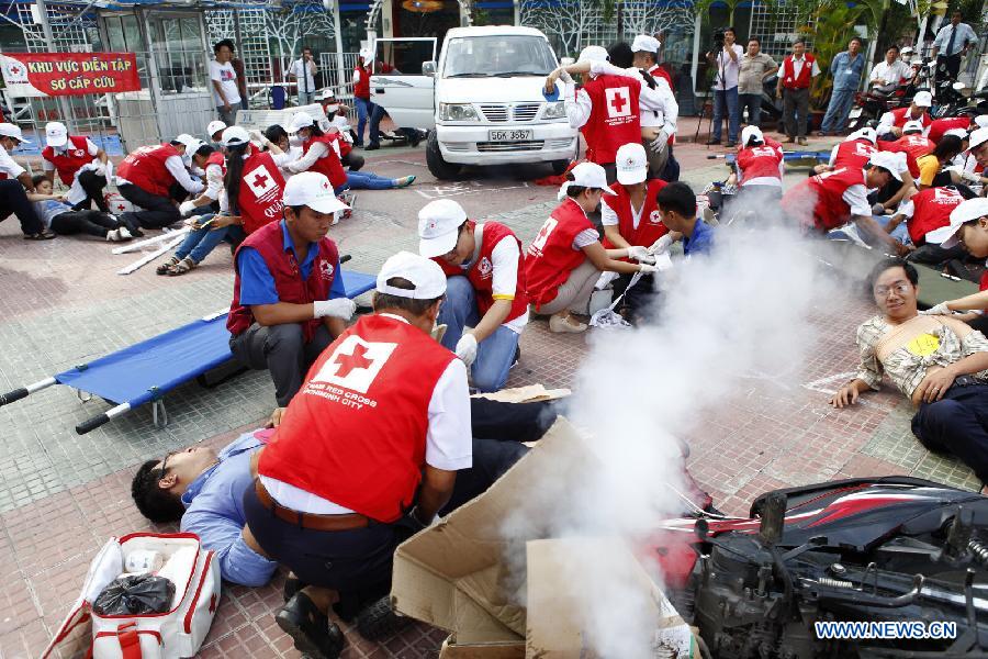 Members Of Red Cross Society Giving First Aid To Injured People World First Aid Day