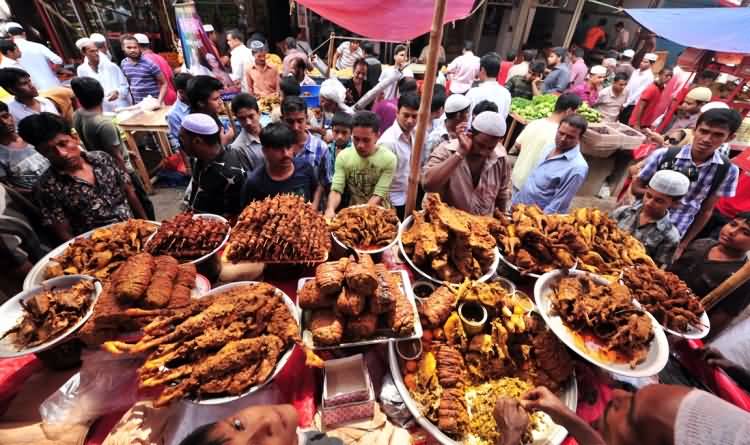 Muslim People Enjoying Traditional Food During Eid Al-Adha Celebrations
