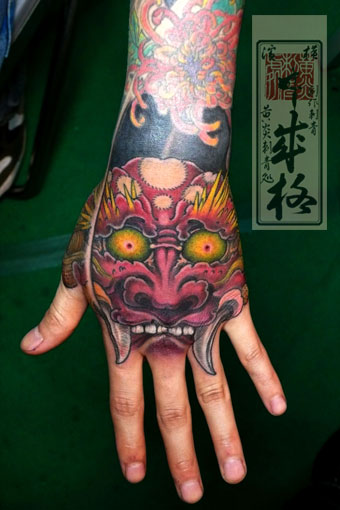 Shige Hannya Mask Tattoo On Left Hand