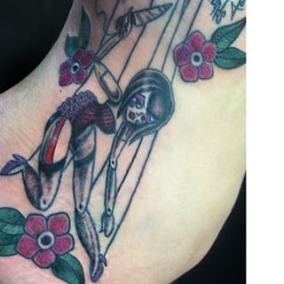 Traditional Marionette Doll With Flowers Tattoo Design For Side Rib
