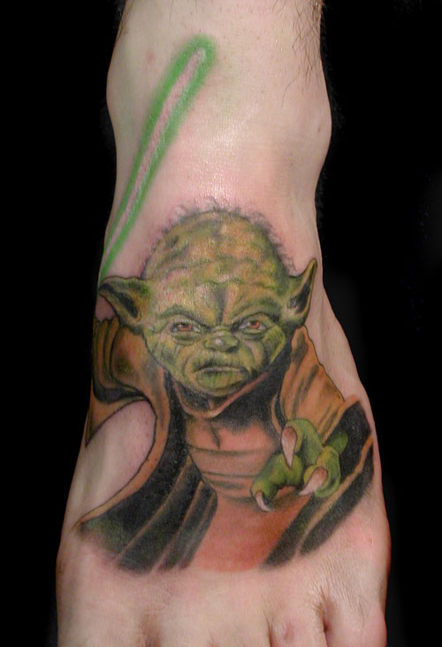 Yoda With Lightsaber Tattoo On Left Foot