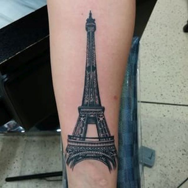 Black And Grey Eiffel Tower Tattoo On Left Forearm
