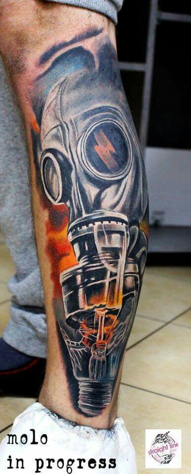 Black And Grey Ink Flaming Bulb With Gas Mask Tattoo On Leg
