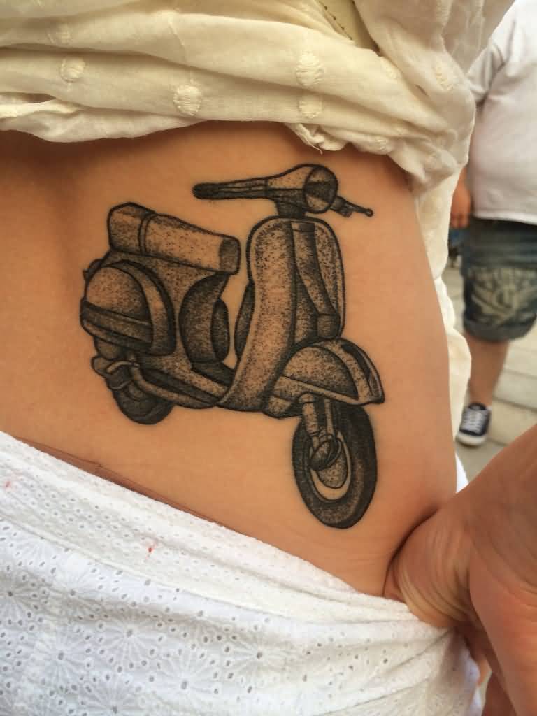 Black And Grey Ink Vespa Scooter Tattoo On Lower Back