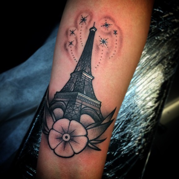 Black And Grey Traditional Eiffel Tower Tattoo On Left Forearm