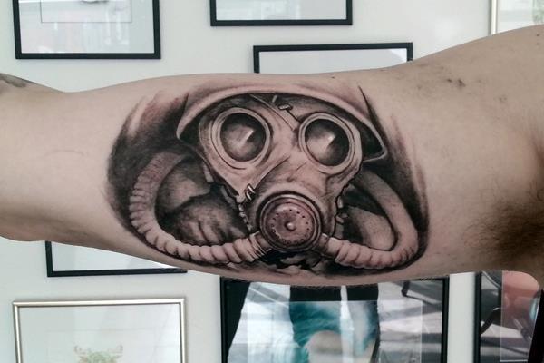 Black And Grey Zombie Gas Mask Tattoo Inner Bicep