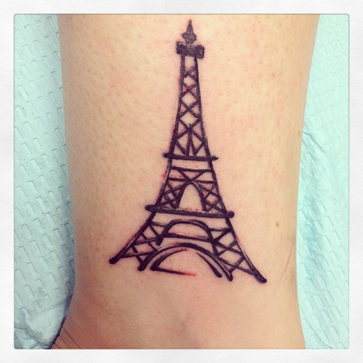 Black Ink Eiffel Tower Tattoo On Leg