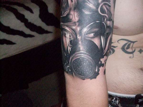 Black Ink Gas Mask Tattoo On Right Arm