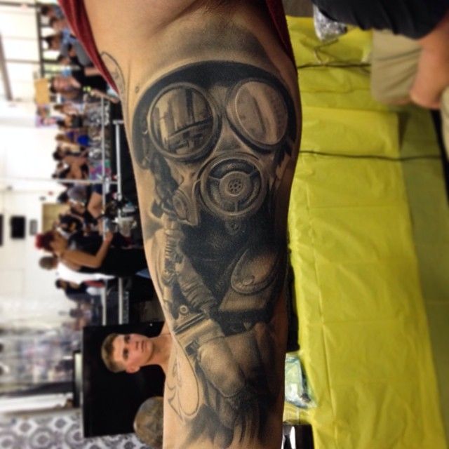 Black and Grey Gas Mask Man Tattoo On Sleeve