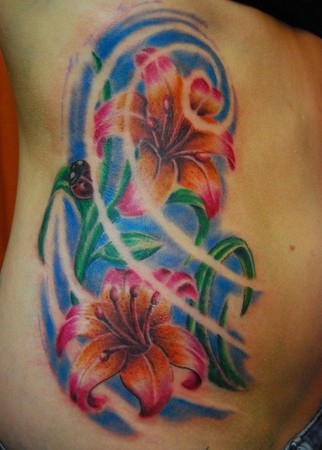 Colored Flowers And Ladybug Tattoo On Side Rib
