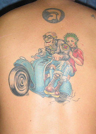 Couple On Blue Scooter Tattoo On Upper Back