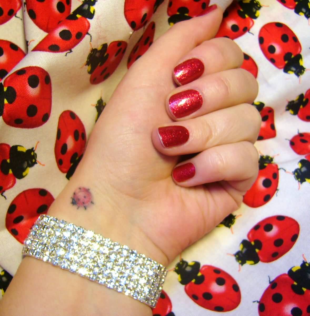 Cute Ladybug Tattoo On Girl Left Wrist
