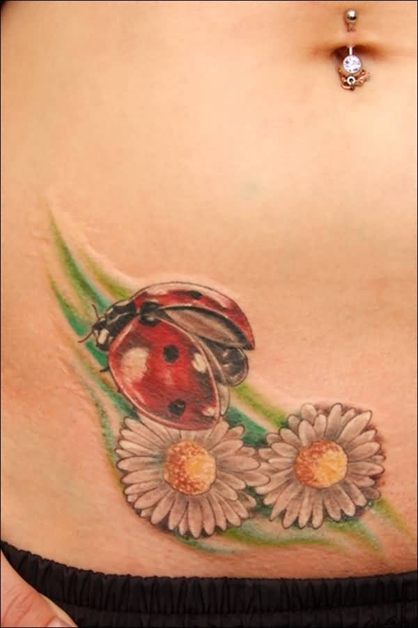 Daisy Flowers And Ladybug Tattoo On Right Hip