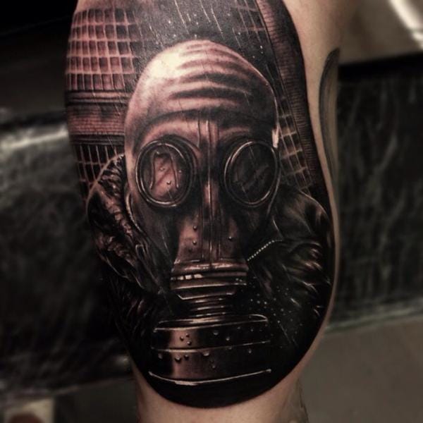 Dark Ink Gas Mask Tattoo On Bicep