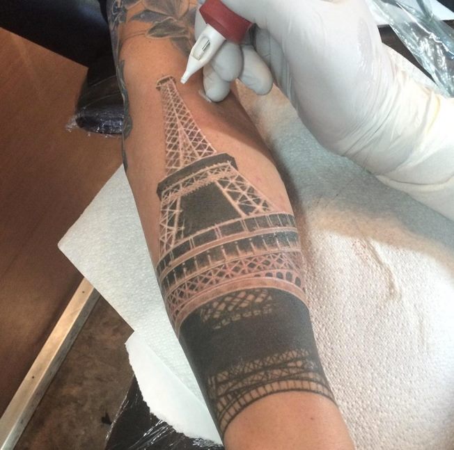 Eiffel Tower Tattoo On Left Forearm by Cash Scott