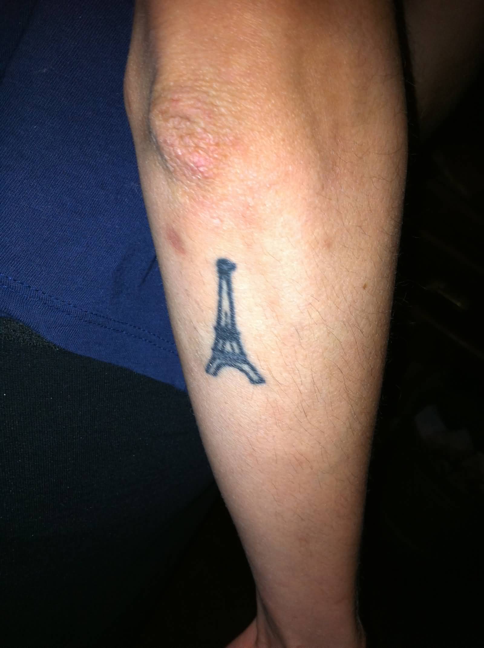 Eiffel Tower Tattoo On Right Arm