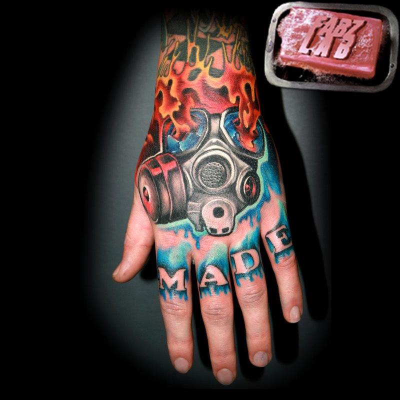Fire Gas Mask Tattoo On Left Hand