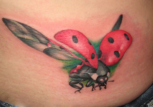 Flying Ladybug Tattoo On Lower Back