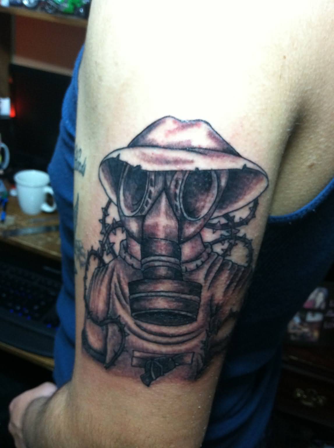 Gas Mask Tattoo On Left Bicep by Ngoc50
