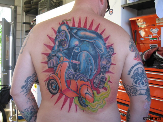 Giant Gorilla On Scooter Tattoo On Back