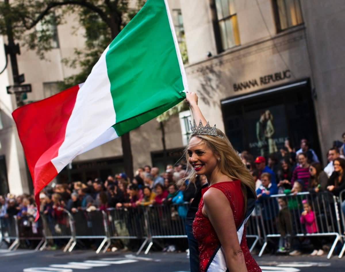 Girl With Italian Flag In Hand Taking Part In Columbus Day Parade