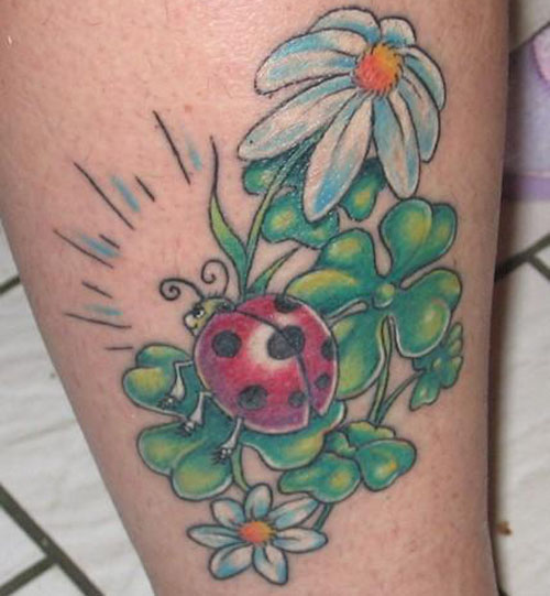 Green Clover Leaf And Ladybug Tattoo On Leg