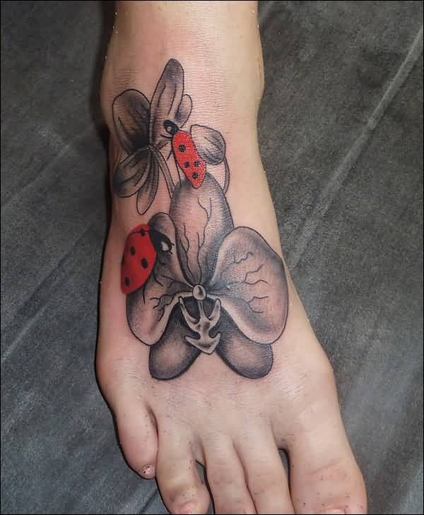 Grey Flowers And Ladybug Tattoos On Right Foot