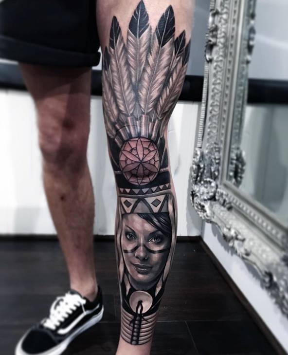 Grey Ink Native American Tattoo On Left Leg by Joe Carpenter