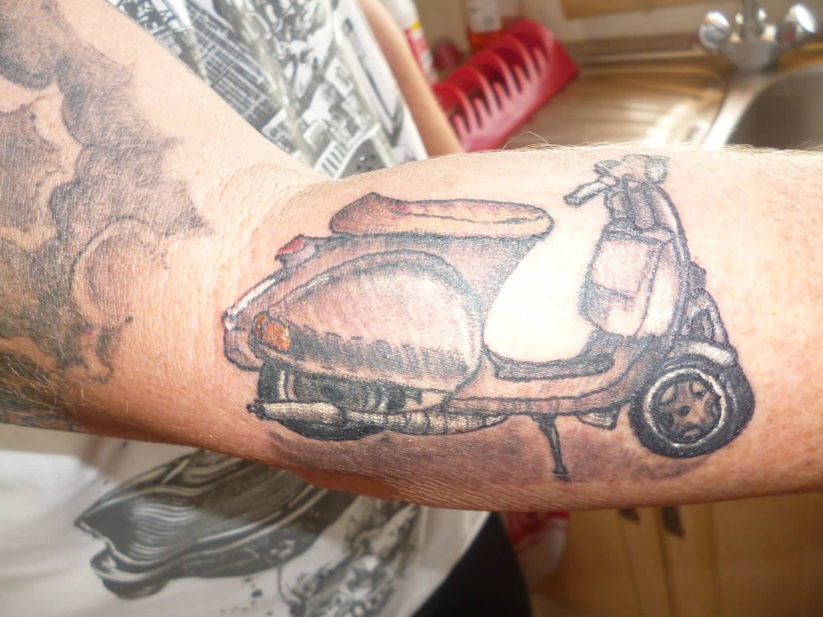 Grey Ink Old Scooter Tattoo On Forearm