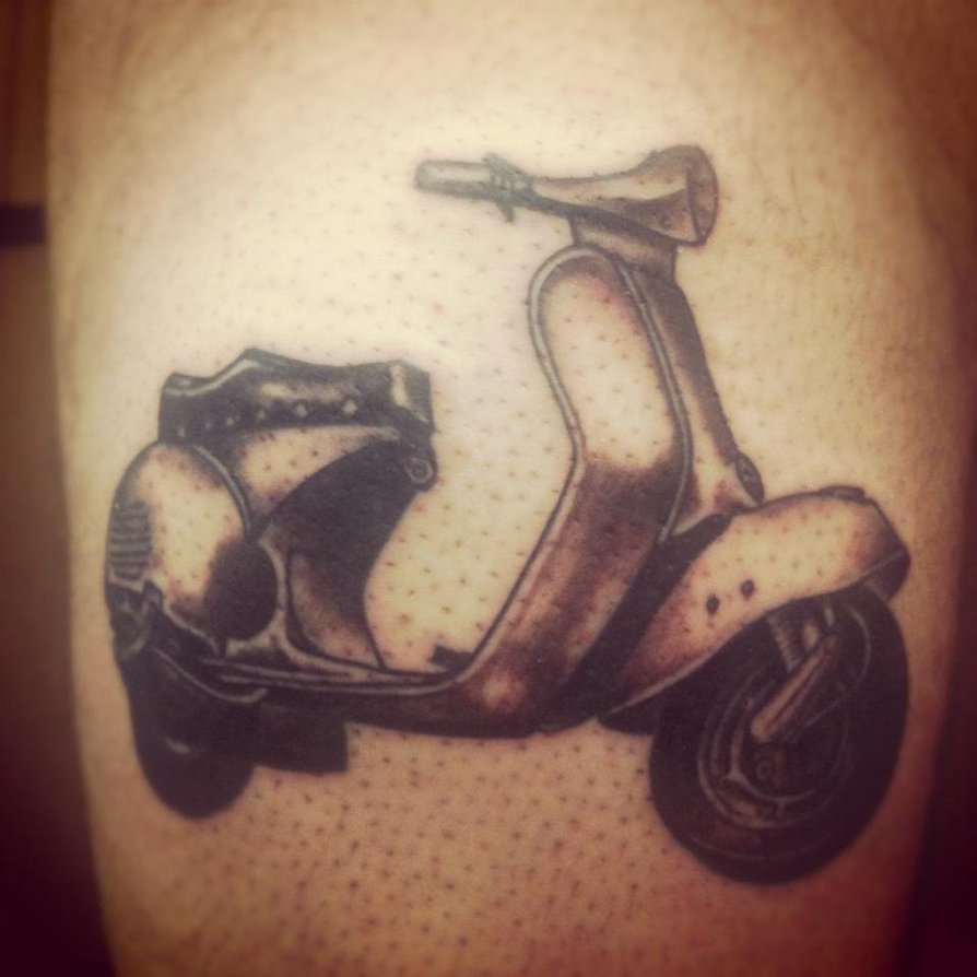 Grey Ink Vespa Tattoo On Bicep by Aliciaquinby
