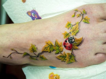 Ivy Leaves And Ladybug Tattoo On Right Foot
