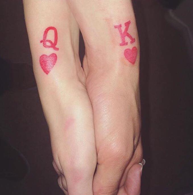 King And Queen Card Symbols Tattoos On Couple Wrist by Revolt Tattoos