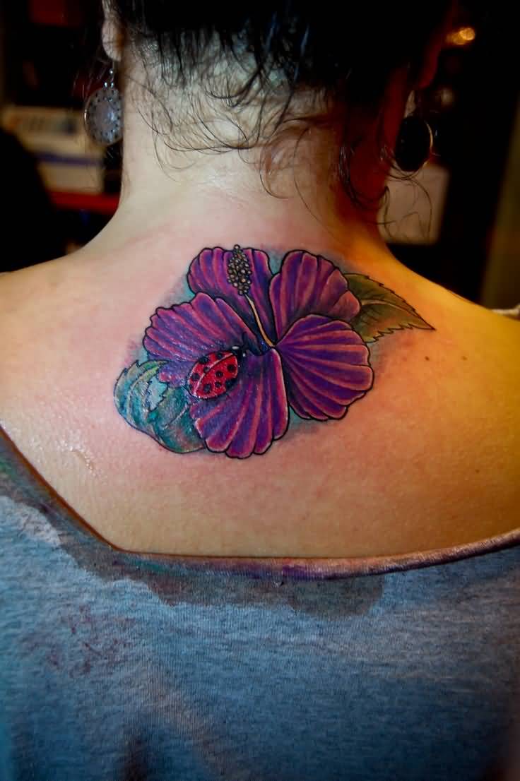 Ladybug On Purple Lily Flower Tattoo On Upper Back