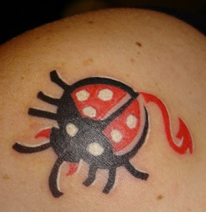 Ladybug With Red Tail Tattoo