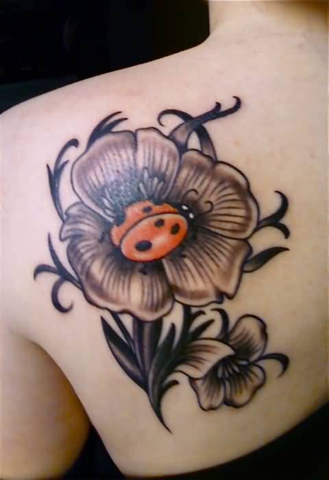 Left Back Shoulder Grey Ink Flower And Ladybug Tattoo
