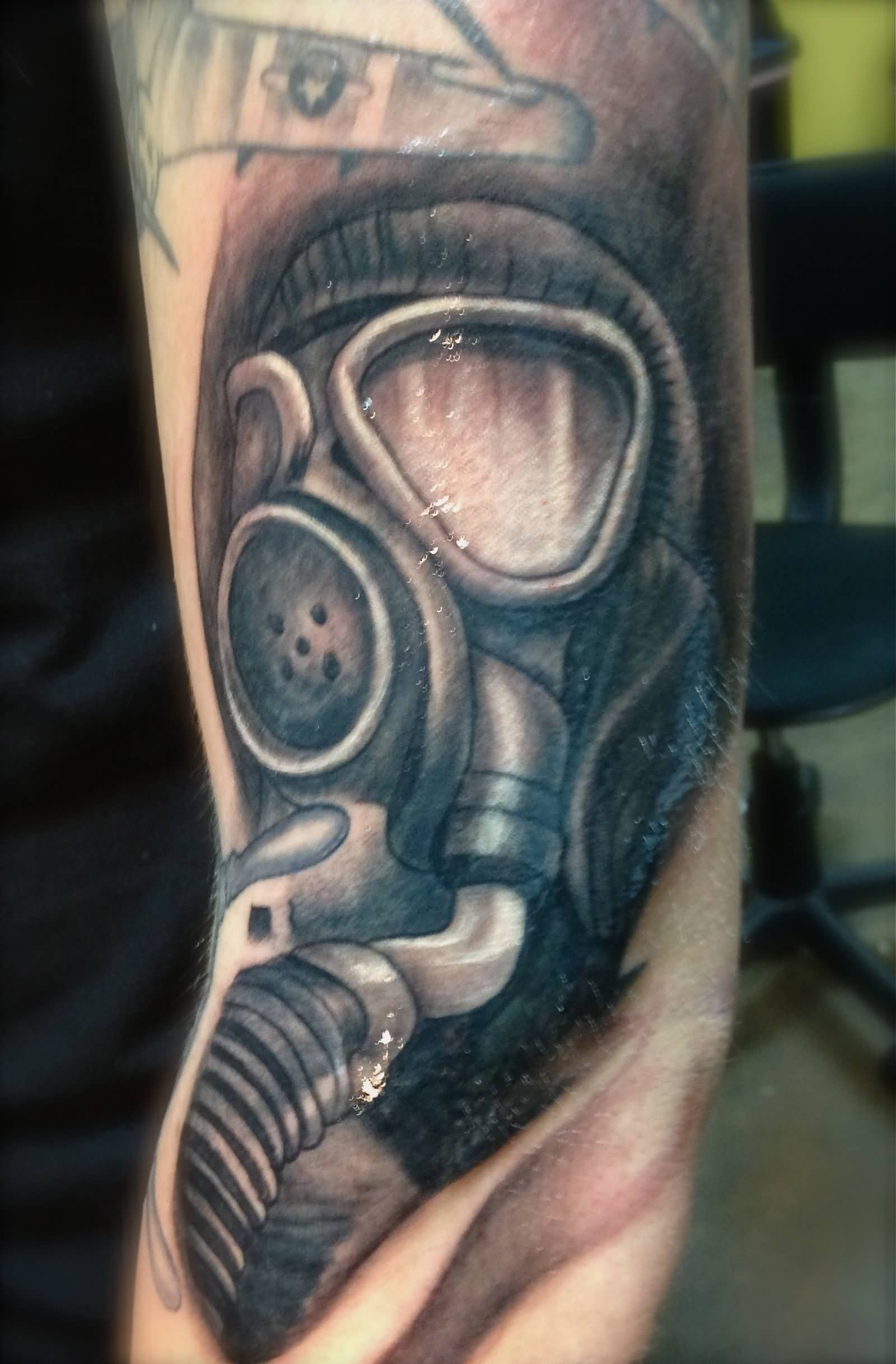 Left Sleeve Grey Ink Gas Mask Tattoo