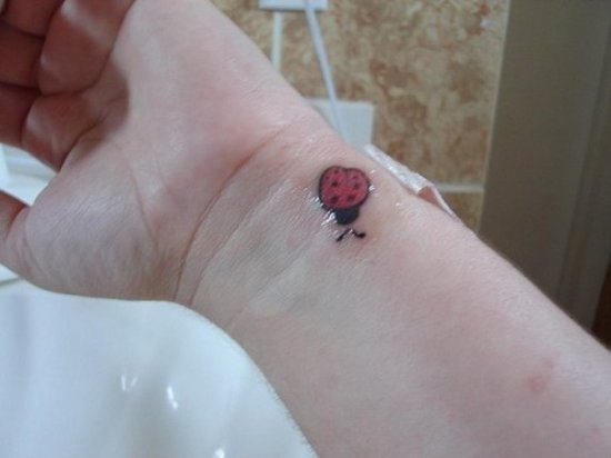 Left Wrist Small Ladybug Tattoo