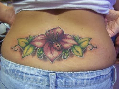 Lower Back Flowers And Ladybug Tattoo
