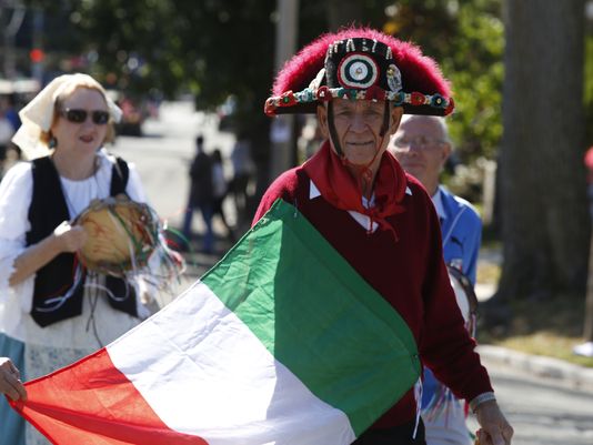Old Man With Italian Flag Taking Part In Columbus Day Parade