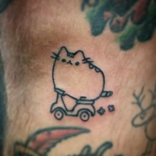 Outline Cartoon Cat And Scooter Tattoo